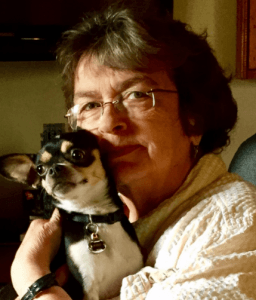 Headshot of Joyce Dean with a chihuahua