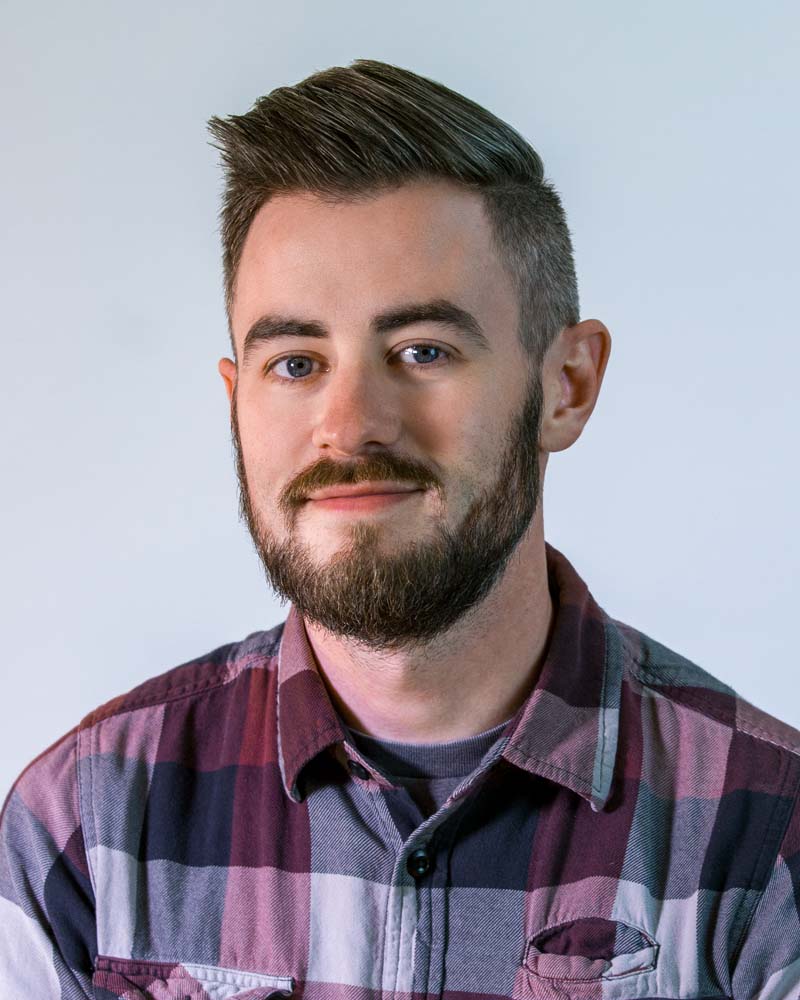 Image: Headshot of Shaun Wood in a circular crop