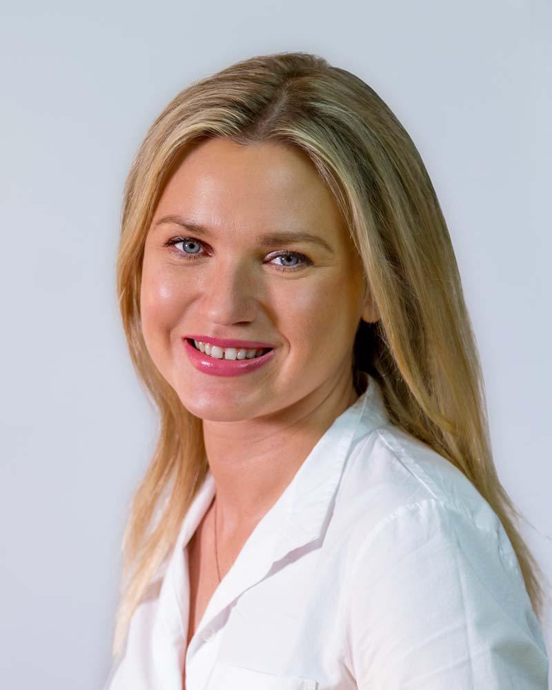 Image: Headshot of Beth McKenney in a circular crop