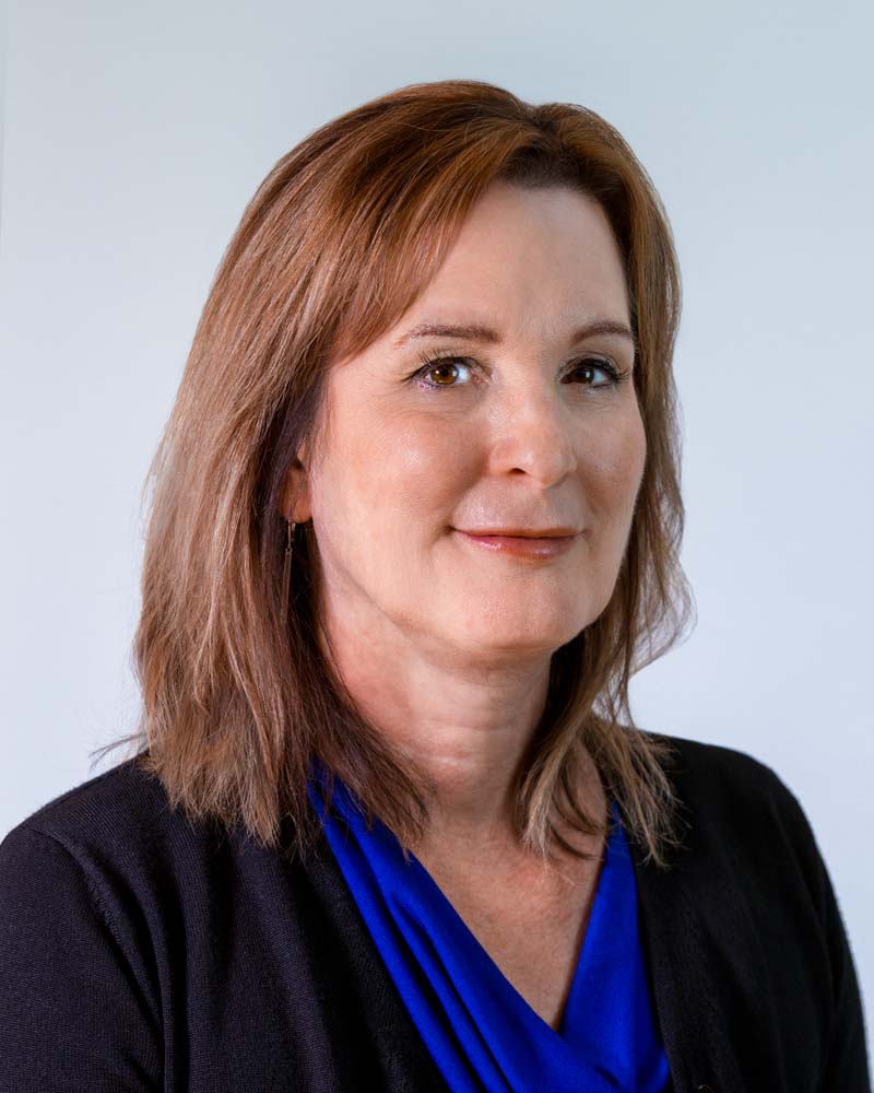 Image: Headshot of Susan Harrell in a circular crop