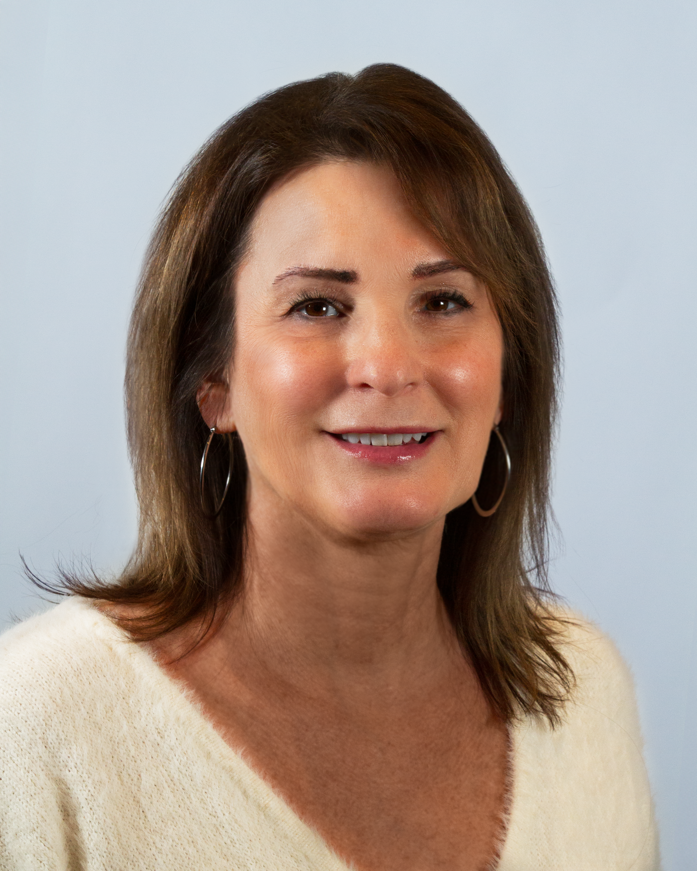 Image: Headshot of Susan Harrell in a circular crop