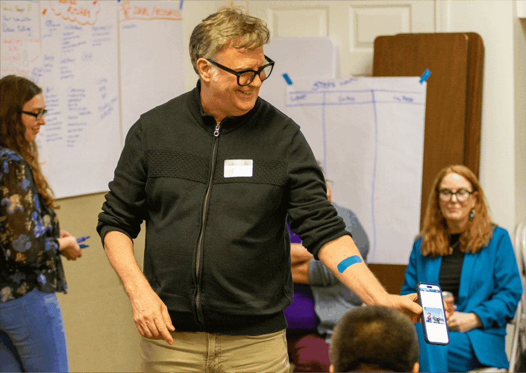 Wise employee instruction on how to access trainings collections on a phone.
